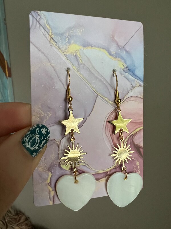 Gold-plated handmade drop earrings with mother-of-pearl heart pendant